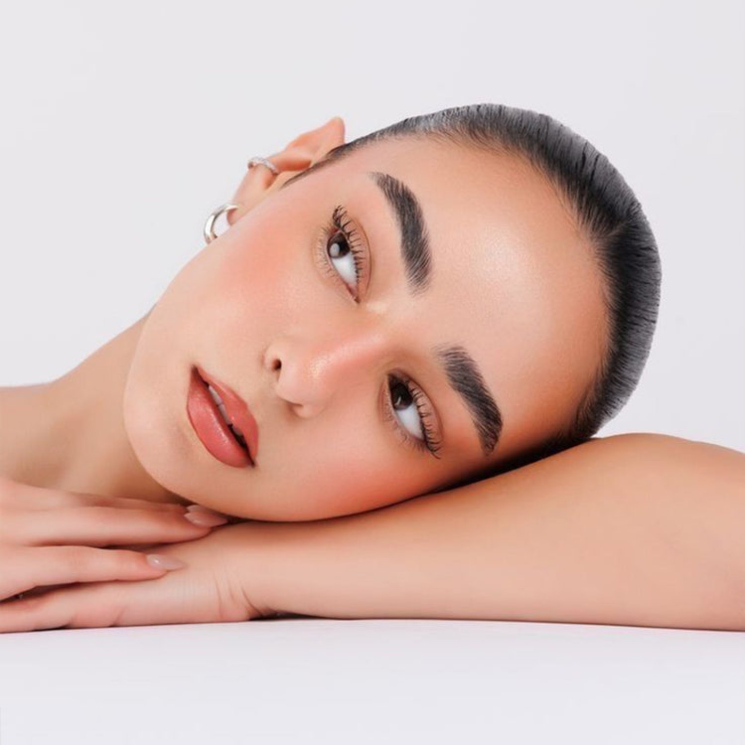Elegant portrait highlighting naturally defined brows and lips
